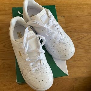 All white kids Puma sneakers